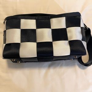 Navy blue and white checkered bag made from seat belt restraints.  Never worn.
